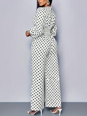 Chic white polka dot wide-leg jumpsuit with balloon sleeves and smocked waist.