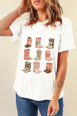 White t-shirt with a graphic print of nine cowboy boots in various western motifs and colors.