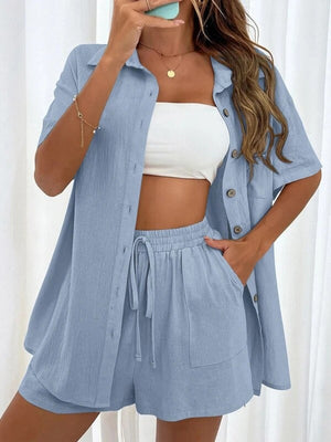 Light blue linen shirt and shorts set with button front and drawstring waist.