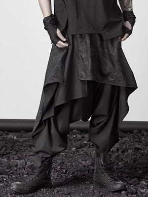 Black avant-garde layered harem sweatpants with asymmetrical design and dropped crotch.