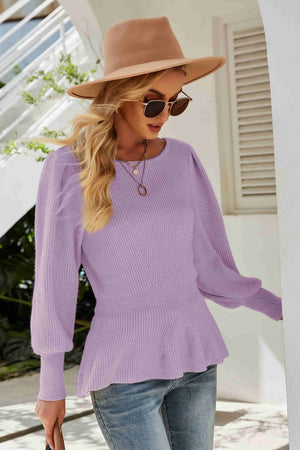 Lavender ribbed knit peplum top with puff sleeves and a round neckline.
