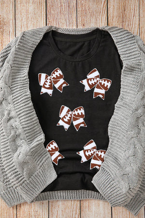 Black t-shirt with football bow graphic print, crew neck, short sleeves.