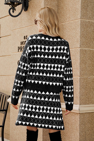 Black argyle knit cardigan and mini skirt set with button detail.