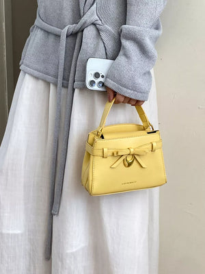 Bow Pu Leather Crossbody Bag in Yellow, side view