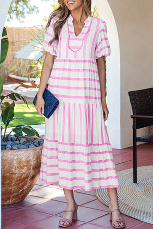 Maxi dress with pink stripes, notched neck, short sleeves, and tiered skirt.