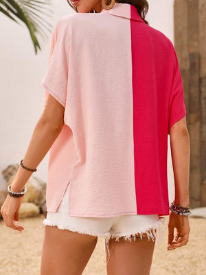 Colorblock silk-effect collared blouse in pink and hot pink with short sleeves and side slits.
