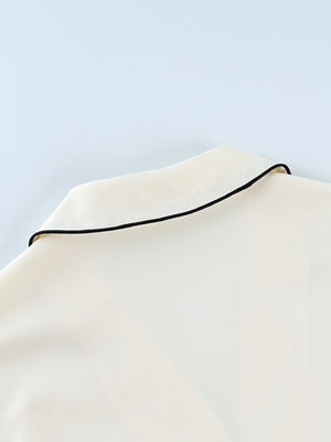 Cream button-up lounge set with black piping detail on collar