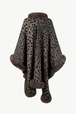 Leopard print cape with faux fur trim in beige, featuring a cozy collar and hem detail.