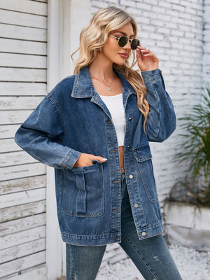 Denim button-up jacket in dusty blue with chest pockets and a relaxed fit.