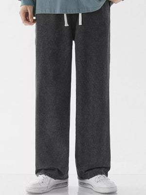 Relaxed wide-leg jeans in dark gray denim with a drawstring waist.