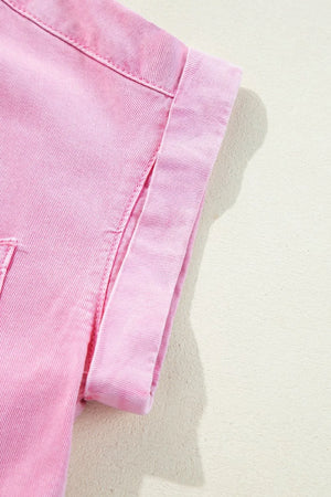 Rolled sleeve denim shirtdress in blush pink with button details.