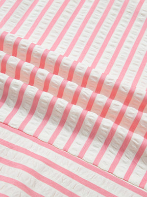 Pink and white striped textured blouse fabric detail