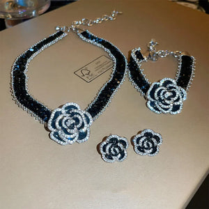 Black crystal rose choker necklace with matching bracelet and earrings.