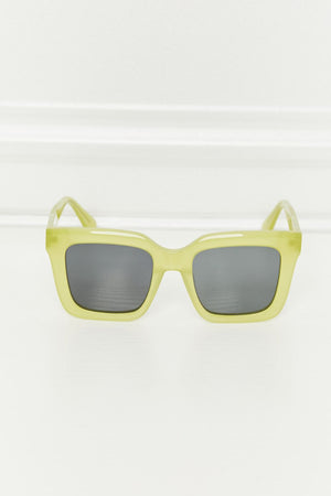 Citron box frame sunglasses with dark lenses and acetate frames.