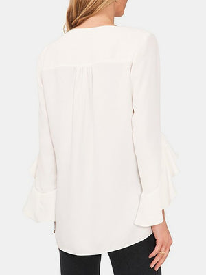 White chiffon blouse with V-neck and flared sleeves.