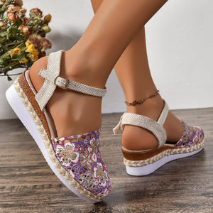 Floral espadrille wedge sandals with adjustable strap in purple and ivory.