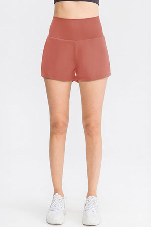 Sculpted high-waist active shorts in Dusty Pink with a V-shaped waistband.