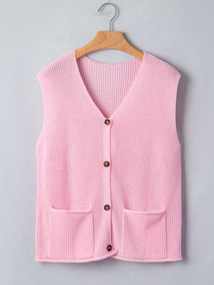 Pink acrylic button front V neck sweater vest with two front pockets.