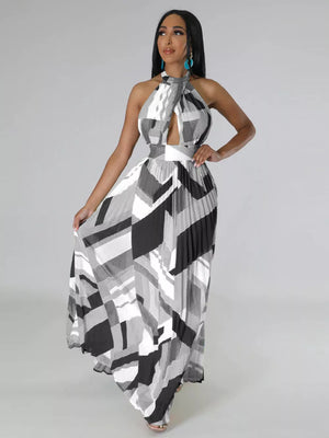 Halter neck maxi dress with geometric print, defined waistband, and pleated skirt