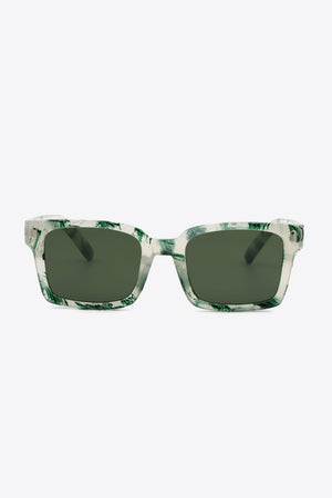 Marble effect rectangular sunglasses with green swirls on a clear frame and dark lenses.