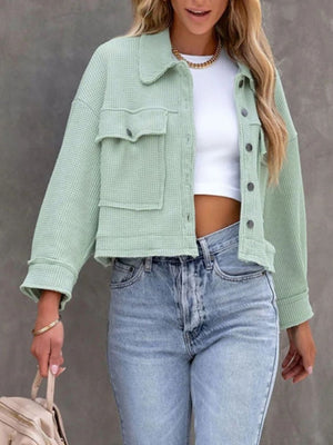 Waffle knit cropped jacket in Moss with buttoned chest pockets and collar.