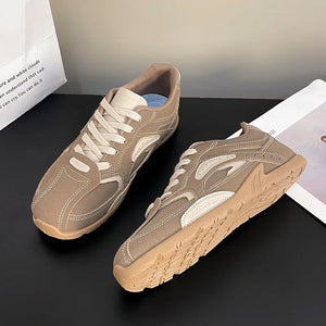 Camel retro runner sneakers with white accents and laces.
