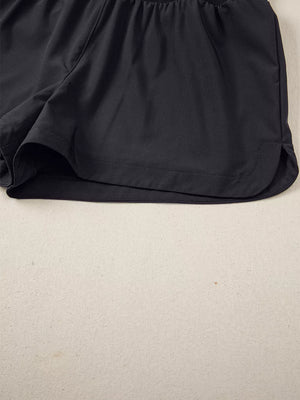 Black athletic jogger shorts with a ribbed waistband and curved hem.