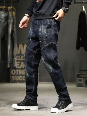 Men's dark wash distressed denim jeans with slim fit and casual styling.