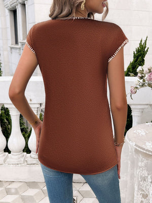 Textured stitch detail cap sleeve top in dark brown with white trim.
