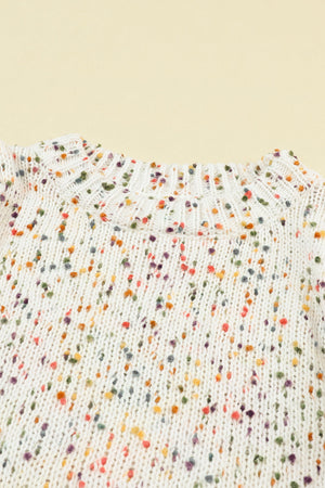 Cream speckled knit sweater with crew neck and ribbed details.