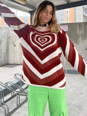 Heartbeat Stripe Mock Neck Knit sweater with a bold heart pattern and chevron stripes in brown and white.