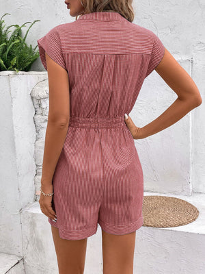 Dusty pink striped shirting romper with short sleeves, collared neckline, and cinched waist tie.