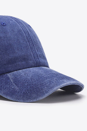 Washed cotton baseball cap in indigo with stitched details on the brim.