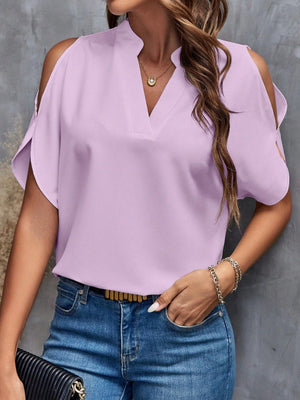 Lilac open-shoulder blouse with V-neck and keyhole detail, made of polyester.