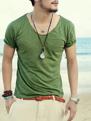Men's relaxed fit scoop neck t-shirt in Grass Green cotton, short sleeves, beach casual style.