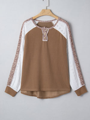 Taupe waffle knit henley top with lace and animal print sleeves.
