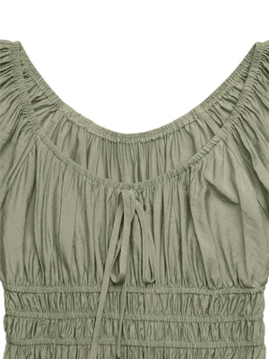 Olive green smocked waist maxi dress with tie-front neckline and ruched bodice.