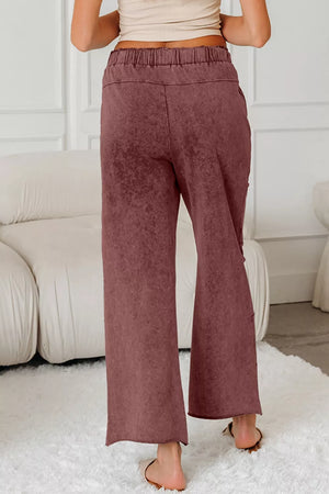 Relaxed wide-leg cotton maternity pants in dusty rose with drawstring waist and cropped length.
