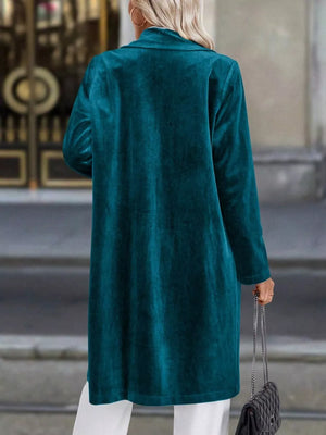 Deep Teal velvet longline trench coat with lapel collar, buttoned front, and long sleeves.