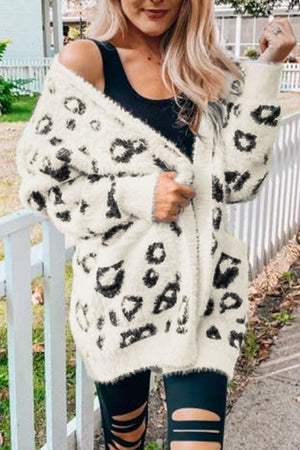 Leopard print plush open cardigan with pockets and long sleeves.