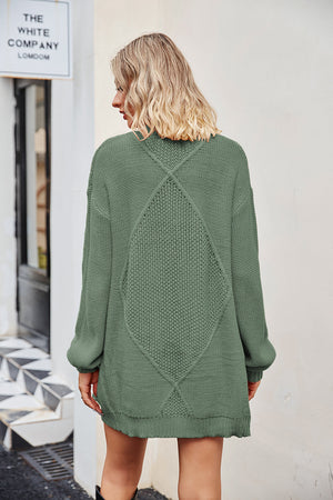 Cable knit cardigan in Gum Leaf acrylic with diamond pattern detail on back.