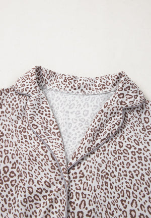 Leopard print pajama top with button-down front and notched collar.
