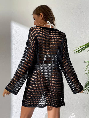 Black sheer crochet knit cover-up with openwork pattern and long sleeves.