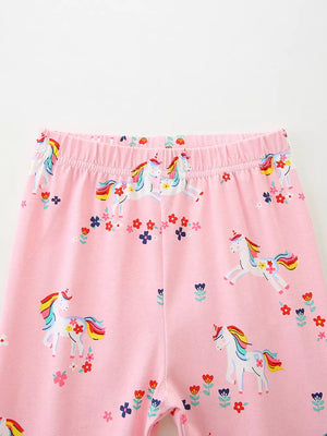 Toddler pink cotton leggings with a unicorn and floral print.