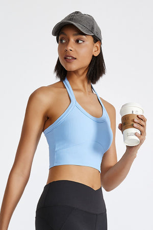 Light blue ribbed halter crop top with a racerback detail.