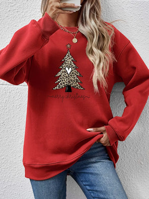 Red sweatshirt with leopard print Christmas tree graphic and Merry Christmas text.