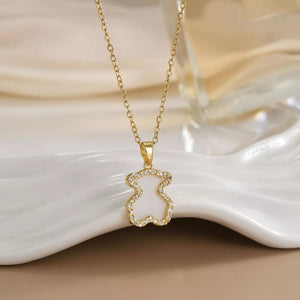 Gold-plated necklace with ivory bear pendant outlined in clear stones