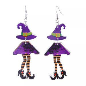 Purple witch hat and legs dangle earrings with striped stockings and black shoes.