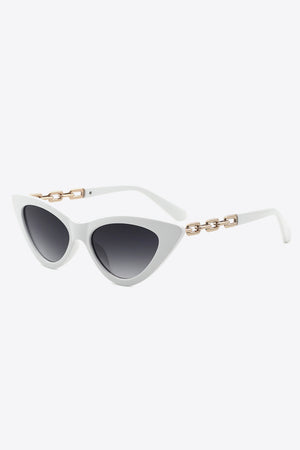 White cat-eye sunglasses with gold chain detail and gradient lenses