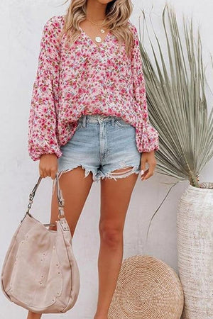 Floral puff sleeve v-neck blouse in blush pink with a casual, flowy fit.